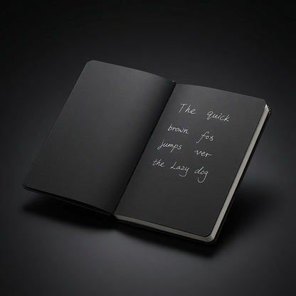 Hardcover notebook with black pages and white ink handwriting - Totem Gift Egypt